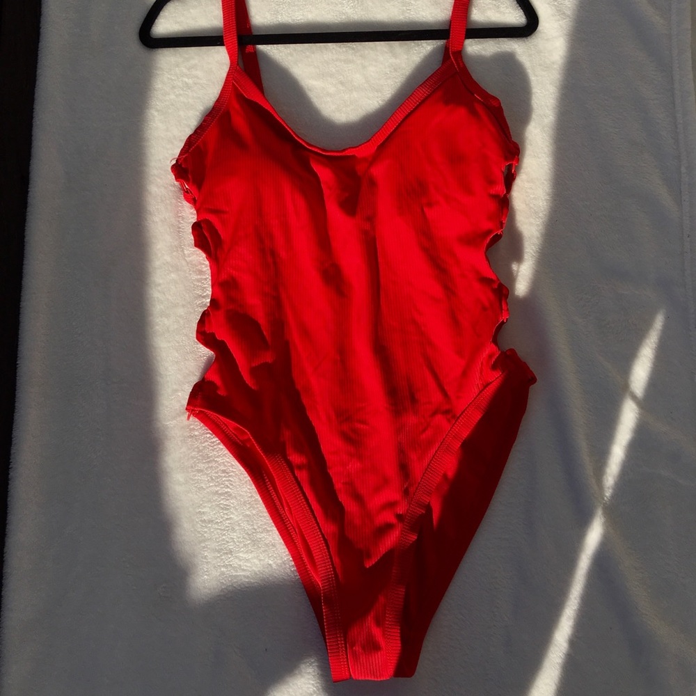 NEW NEVER WORN LOOPED SIDES RED SWIMSUIT